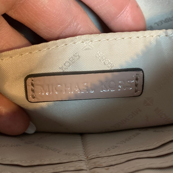 Authentic soft pink patent leather large wristlet clutch by Michael Kors